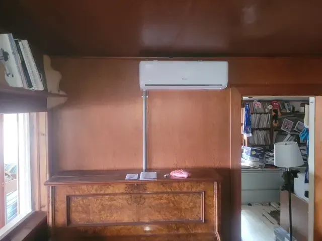 A ductless mini-split head installed in a finished room