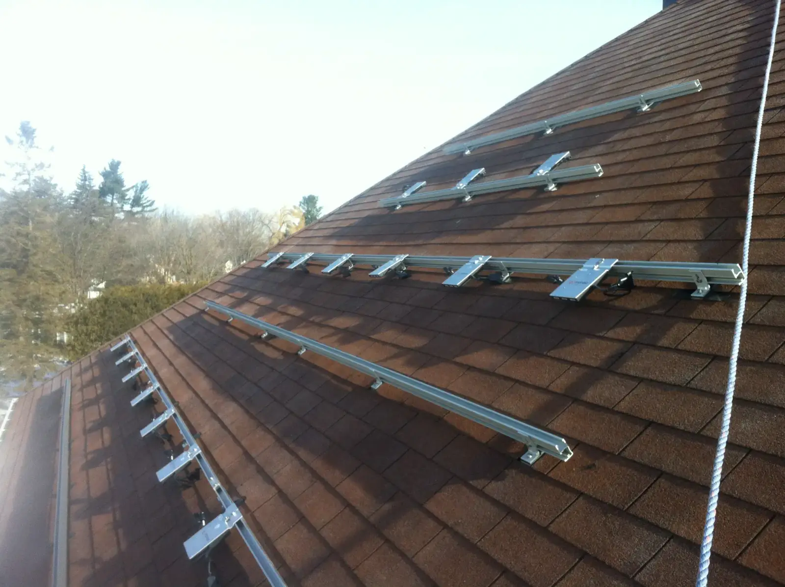 Solar mounting rails installed on a shingle roof