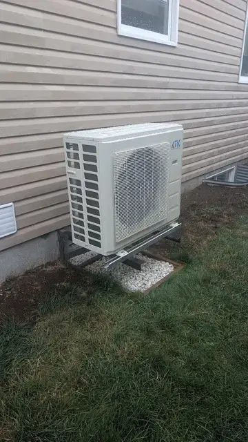 A Denoco outdoor HVAC or heat pump unit on a job site