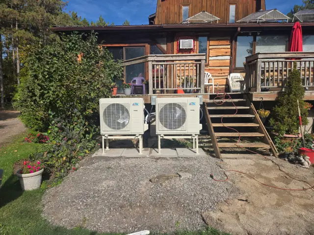 A Denoco outdoor HVAC or heat pump unit on a job site