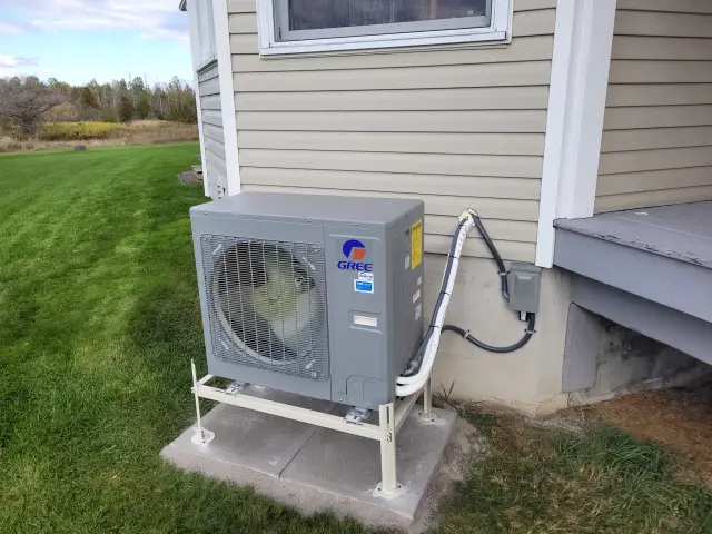 A Denoco outdoor HVAC or heat pump unit on a job site