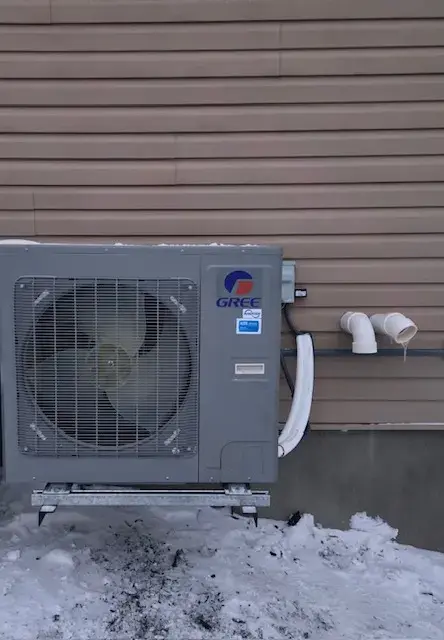 A Denoco outdoor HVAC or heat pump unit on a job site