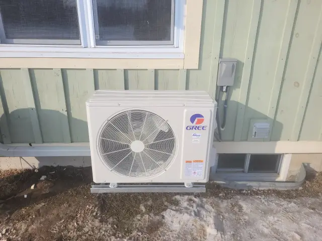 A Denoco outdoor HVAC or heat pump unit on a job site